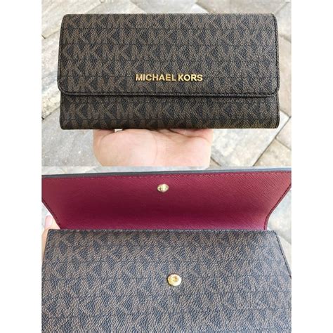 how much does a michael kors wallet cost|Michael Kors oversized wallet.